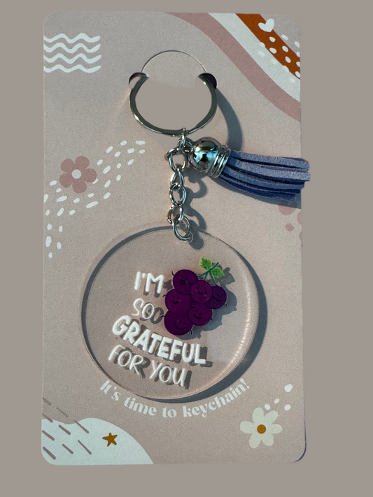 Acrylic round keychains with tassels